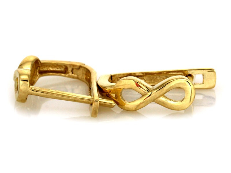 Złote kolczyki wiszące z nieskończonością