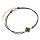 Bransoletka pozłacana na czarnym sznurku koniczynka z onyksem