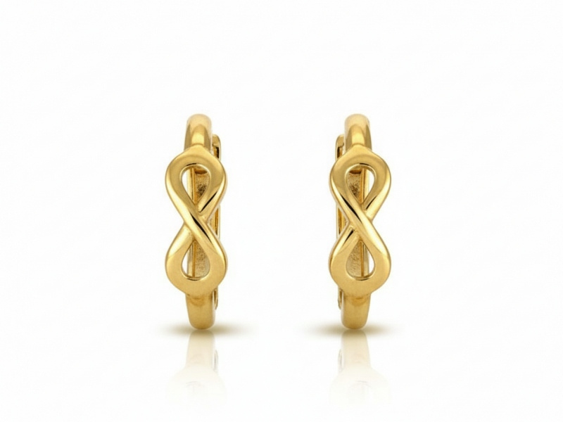 Złote kolczyki wiszące z nieskończonością