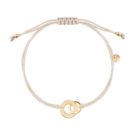 Bransoletka pozłacana z dwoma kółkami na beżowym sznurku