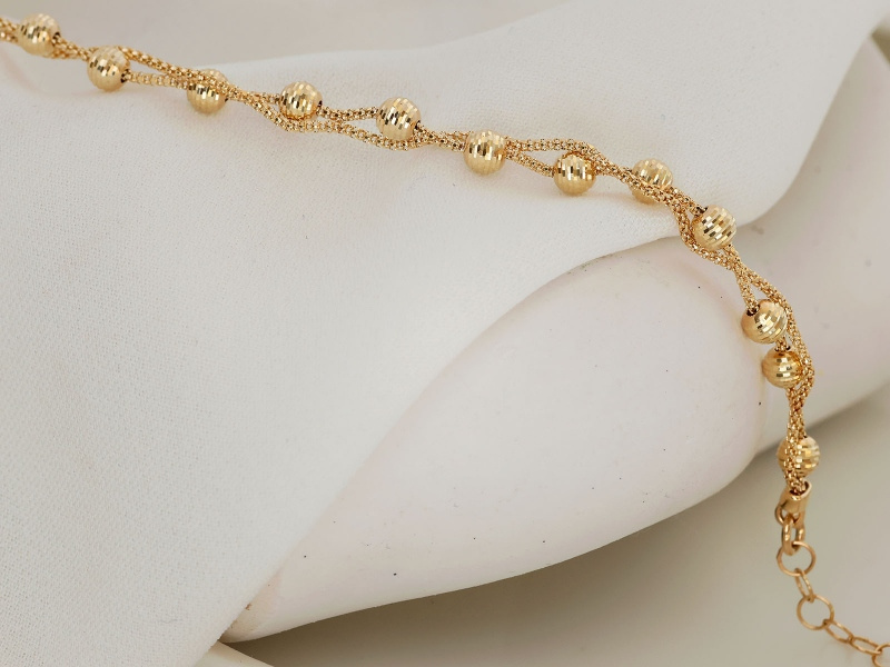 Bransoletka złota z diamentowanymi kuleczkami