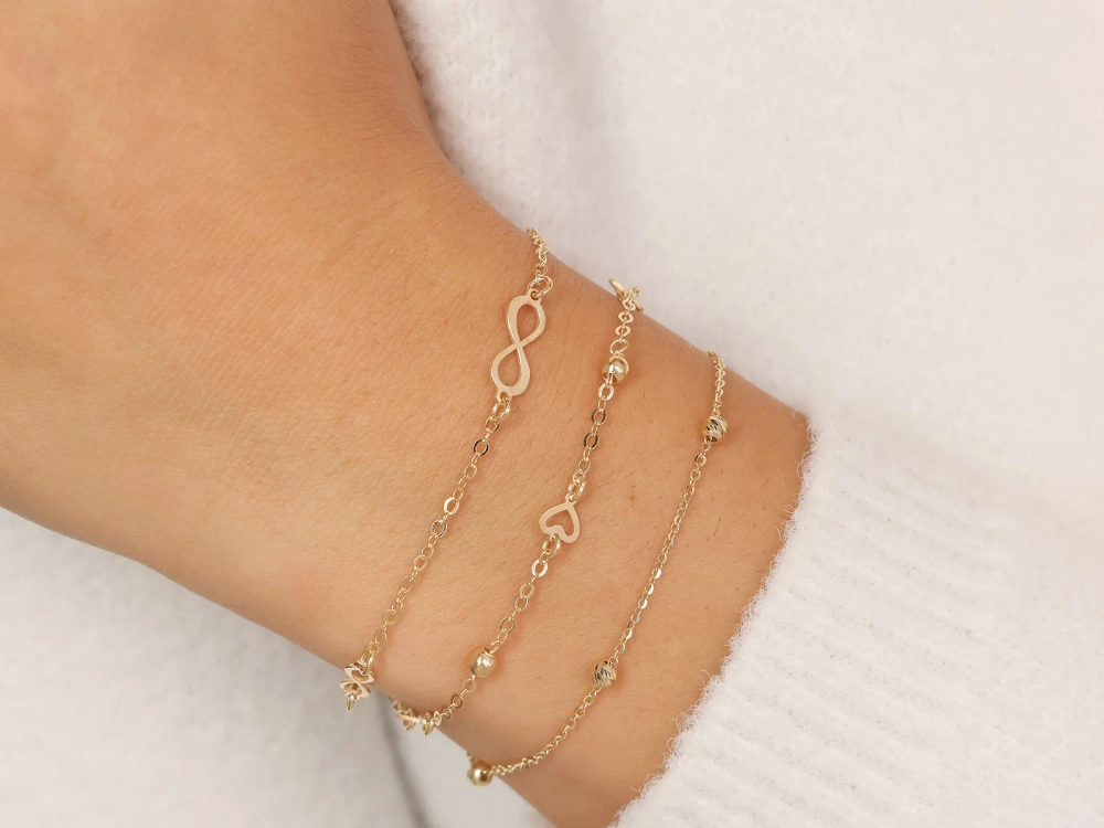 Złota Bransoletka z symbolami nieskończoności
