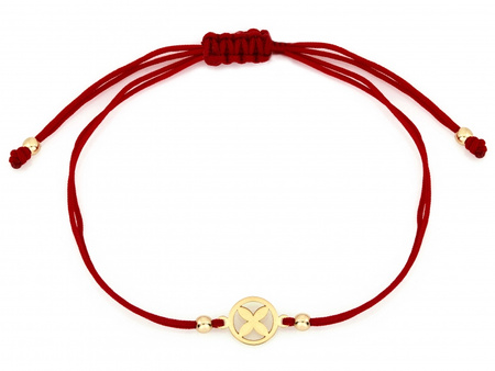 Złota bransoletka z kwiatkiem na czerwonym sznurku