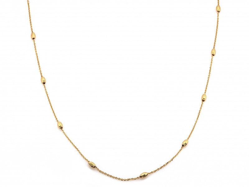 Złoty naszyjnik z diamentowanymi kulkami