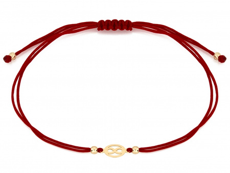 Złota bransoletka z nieskończonością na czerwonym sznurku