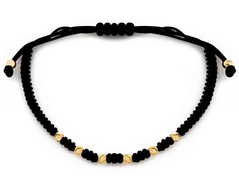 Złota bransoletka z diamentowanymi kulkami na czarnym sznurku