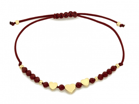 Złota bransoletka serca na bordowym sznurku