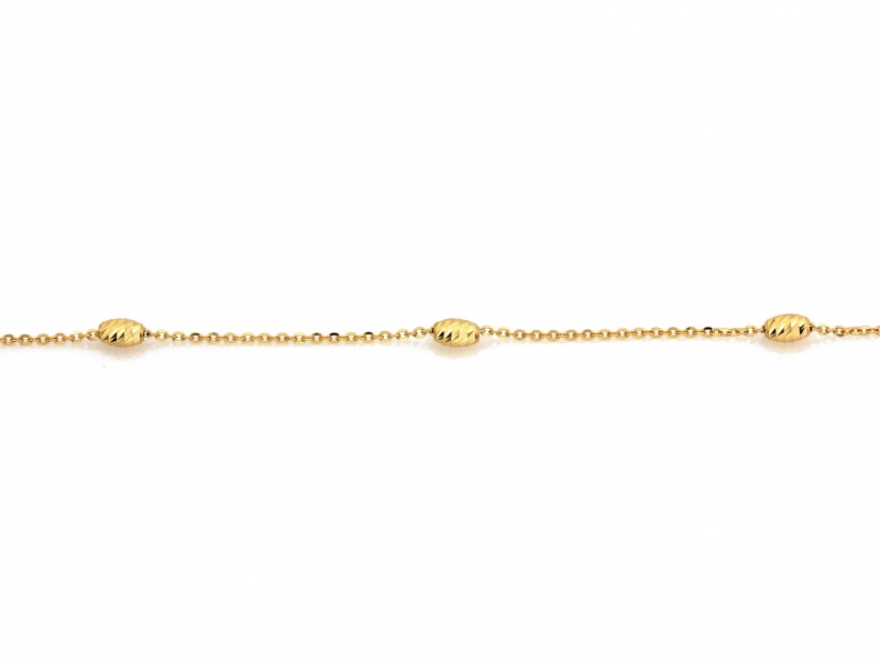 Złoty naszyjnik z diamentowanymi kulkami